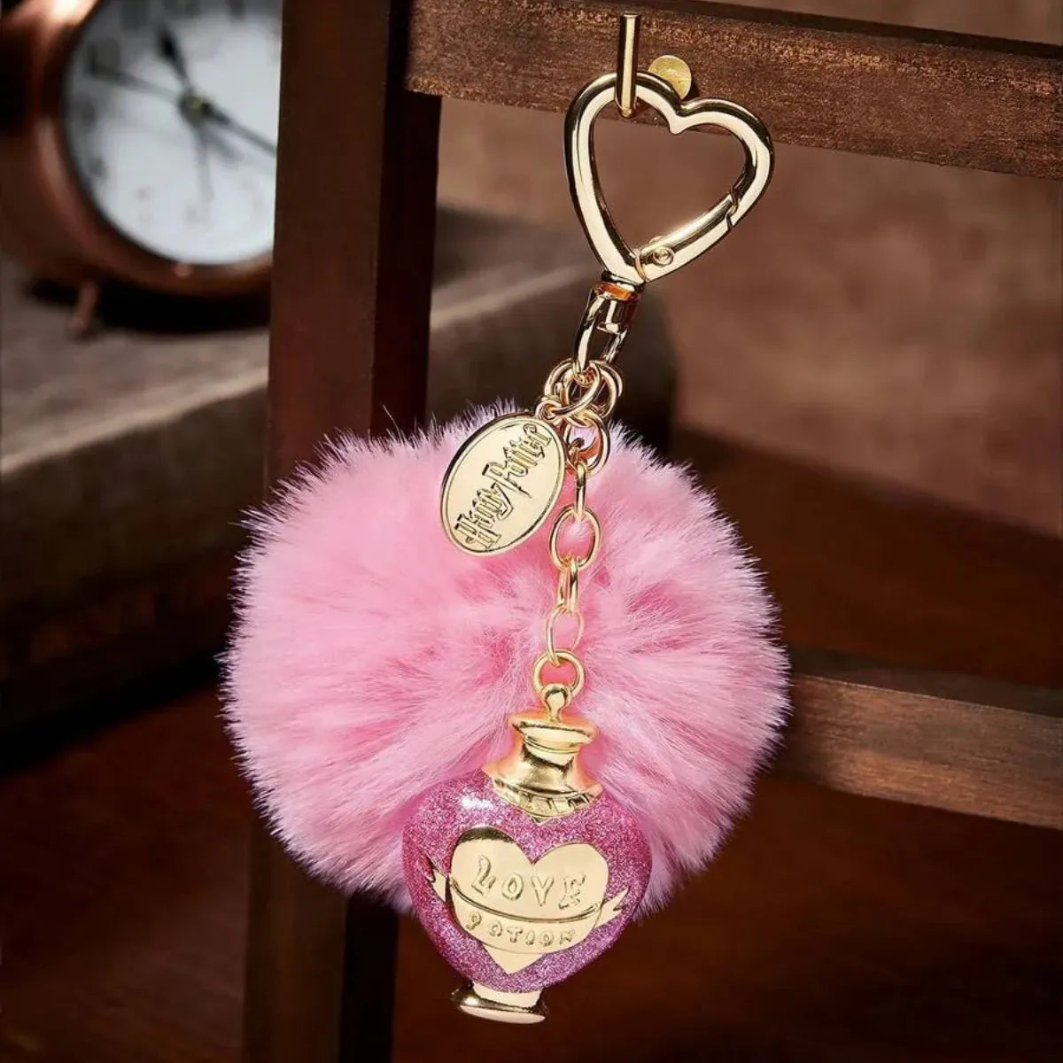 Chaveiro Harry Potter Love Potion Pompom Rosa Metal Dourado